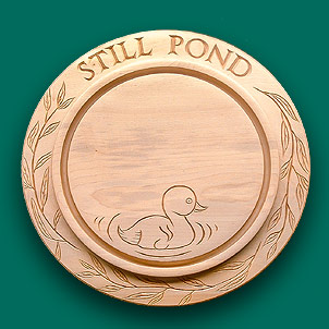 Bread board with a call duck centre engraving