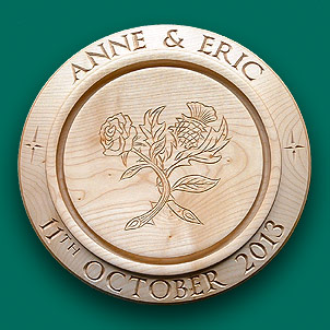 Centre engraved bread board with a rose and thistle.